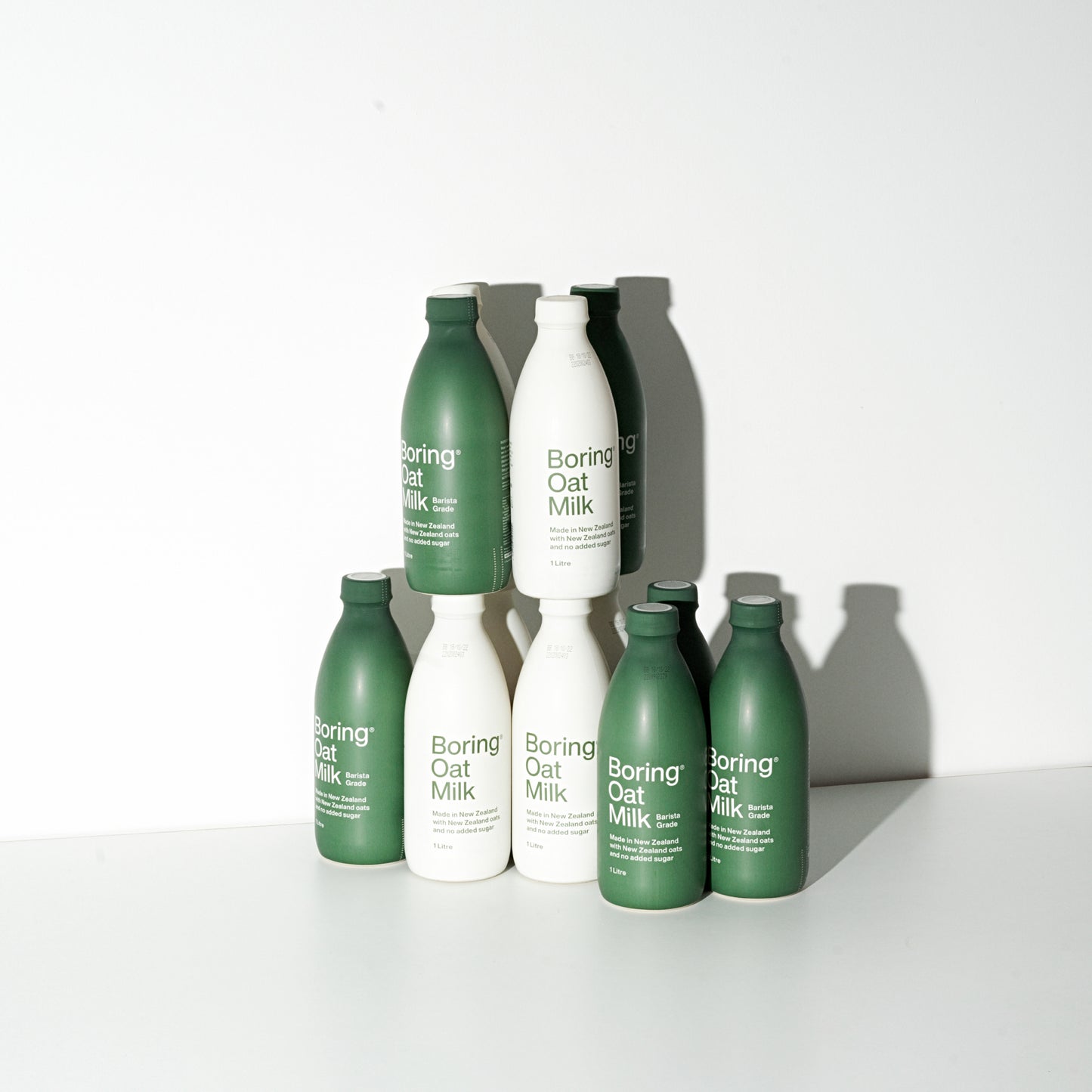 collection of boring oat milk products stacked on one another