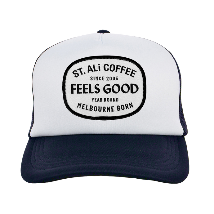 White and navy trucker cap front view with ST. ALi truck logo